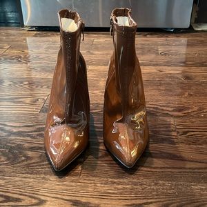 Torrid 8.5 WW brown zipper heel boot. Never worn